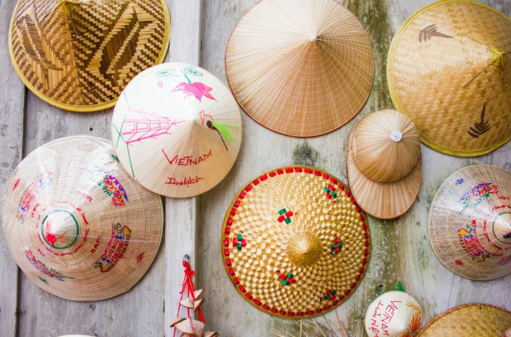 traditional straw hats in Vietnam worn by paddy farmers